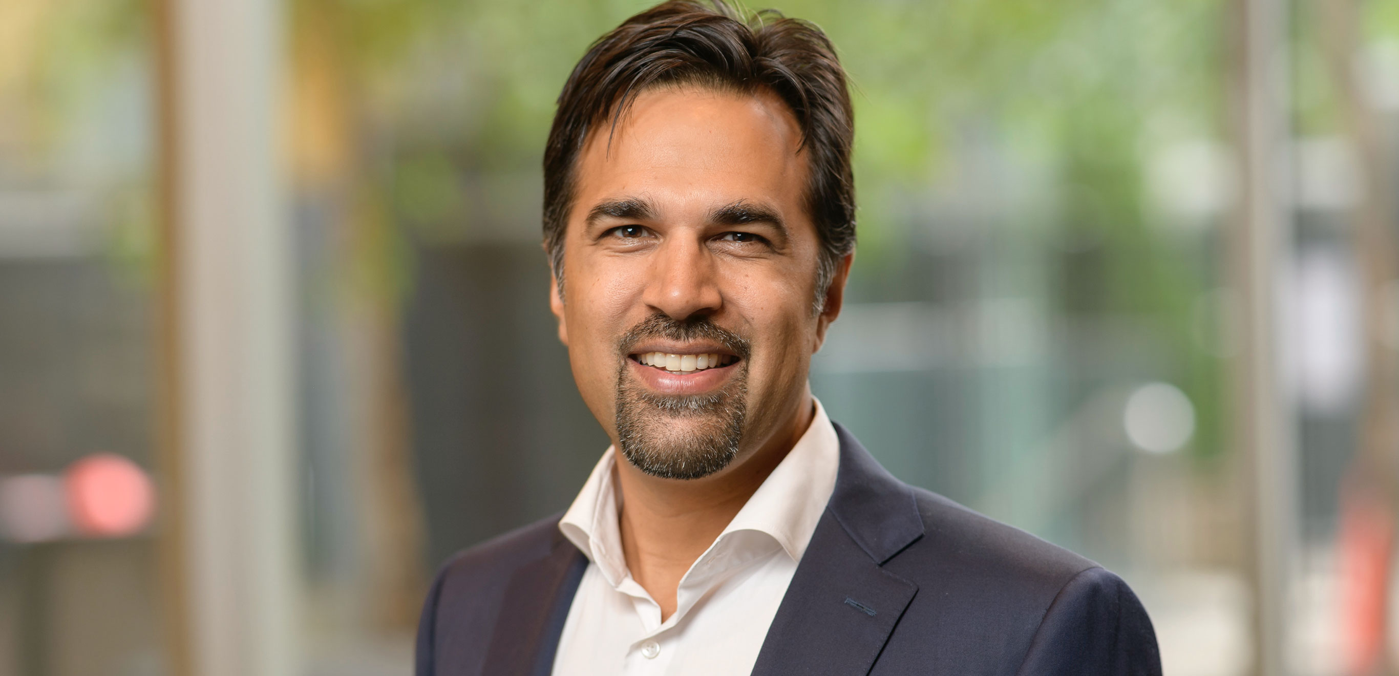 Colleague in a suit smiling