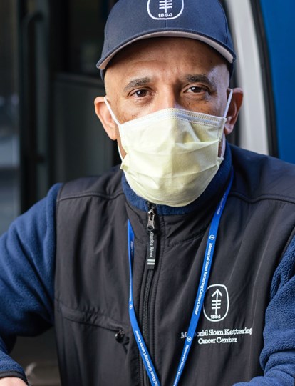MSK colleague wearing a cap and looking out of a truck