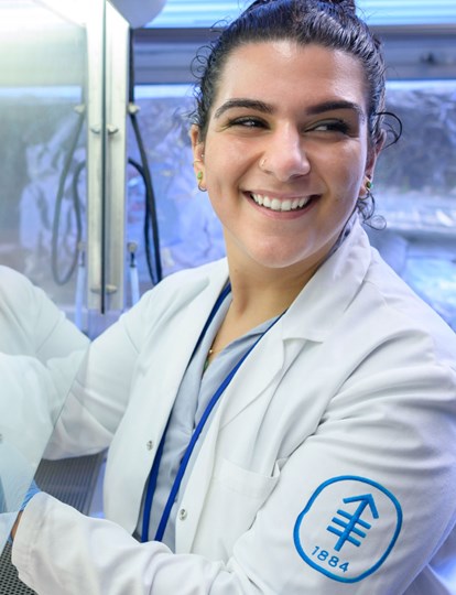 MSK colleague in lab coat working in a lab